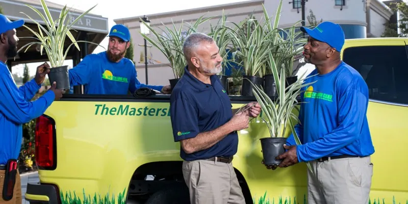 the masters lawn care technicians preparing to work on project